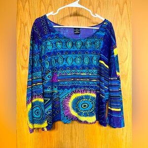 Bold print knit top with sequin detail in front.